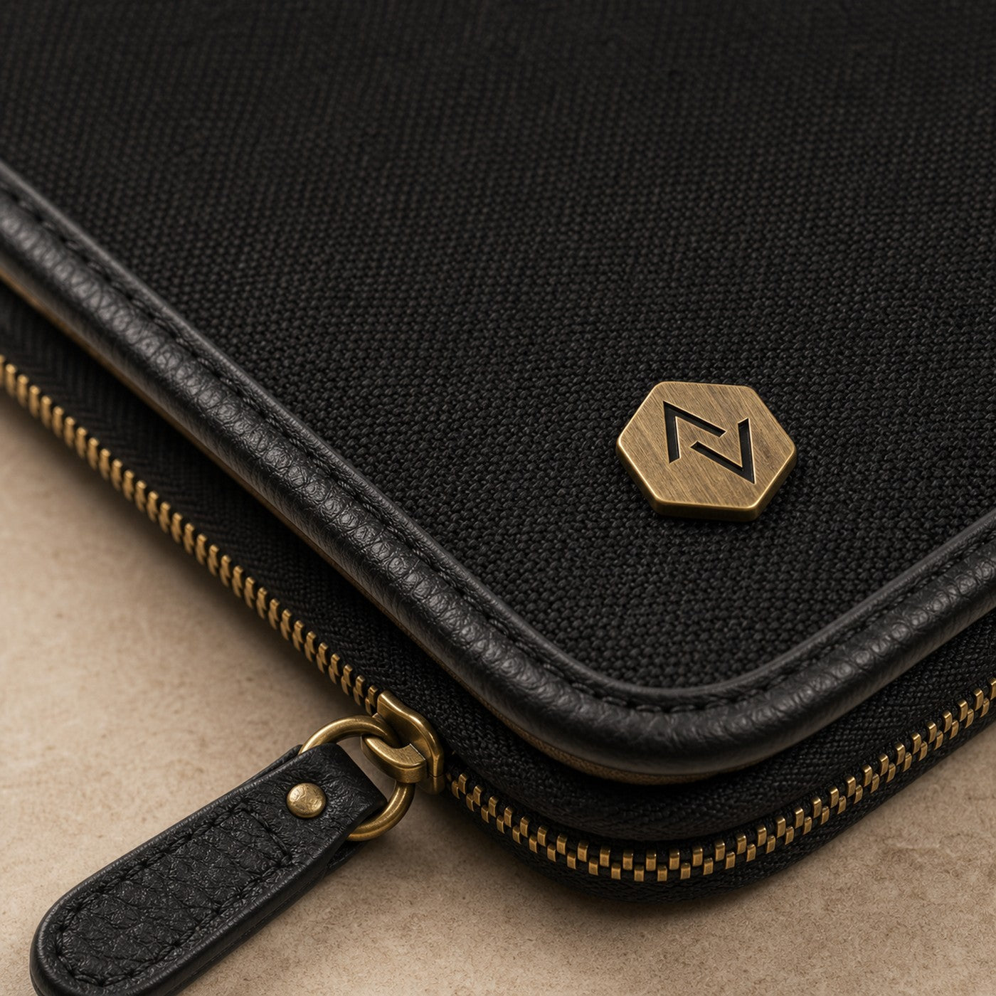 The Tech Folio material, zipper, hardware, and stitching close-up.